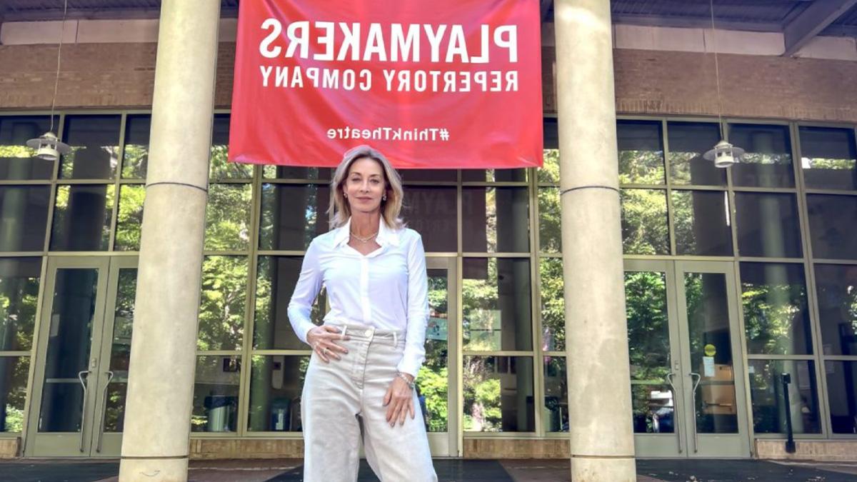 Sharon Lawrence standing in front of playmakers theatre on U.N.C. campus.